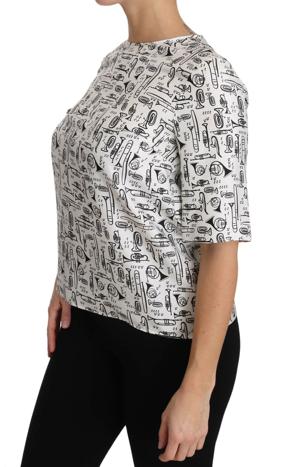 Blusa blanca con estampado de instrumentos musicales