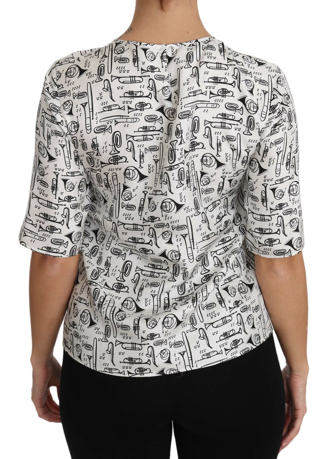 Blusa blanca con estampado de instrumentos musicales