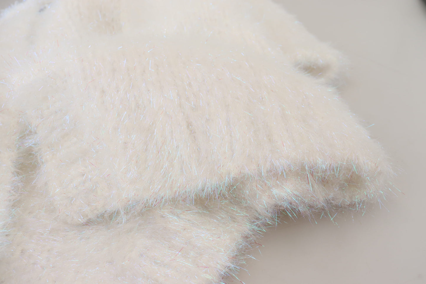 Chaqueta tipo cárdigan blanca de manga larga con flecos