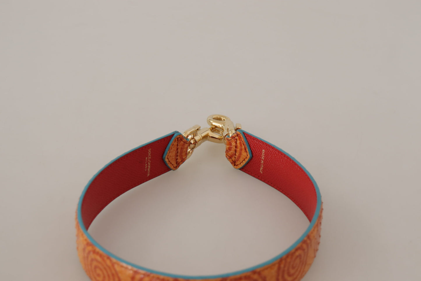 Correa para el hombro para bolso de cuero naranja con estampado de remolinos