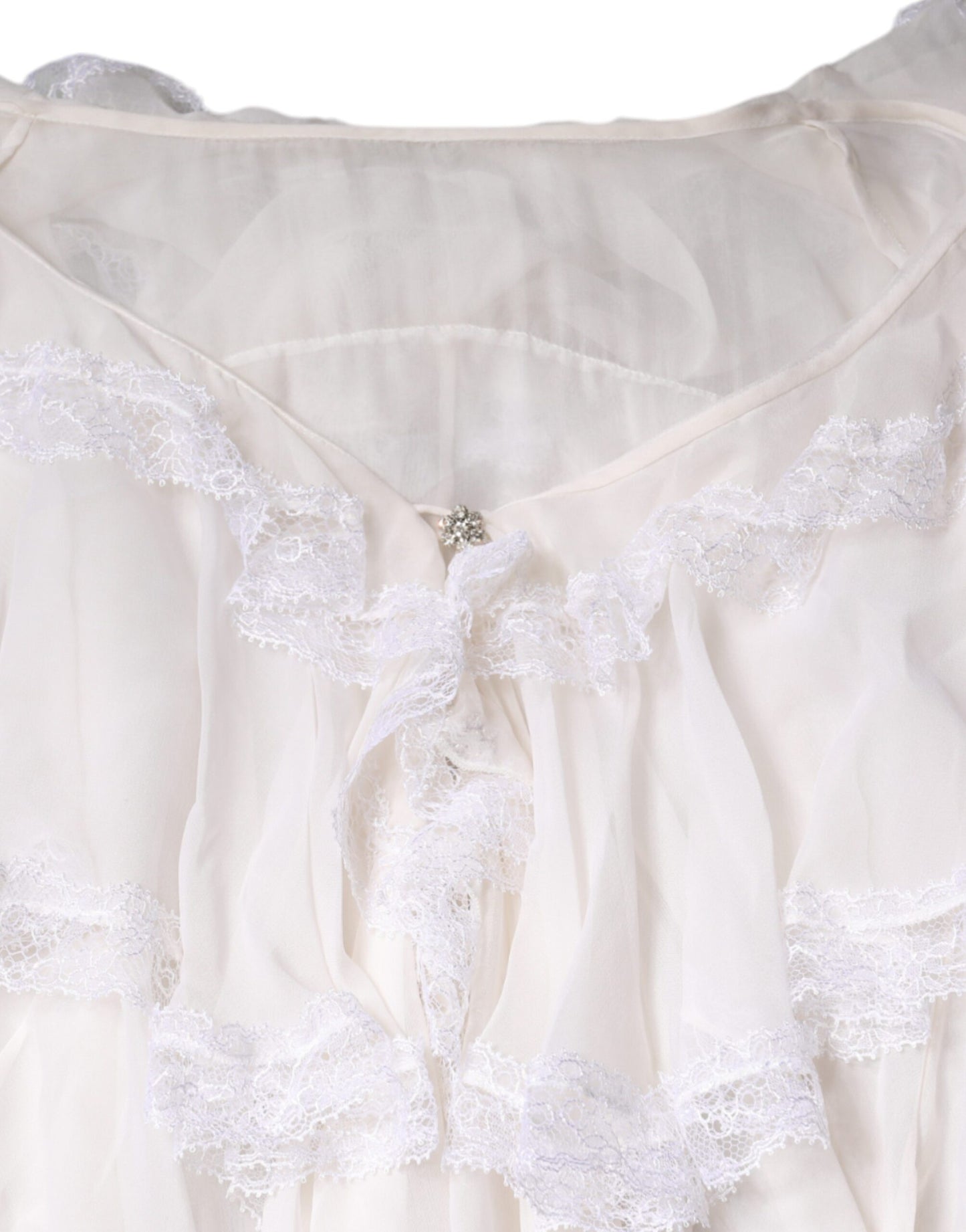 Blusa de manga larga con encaje y volantes blancos