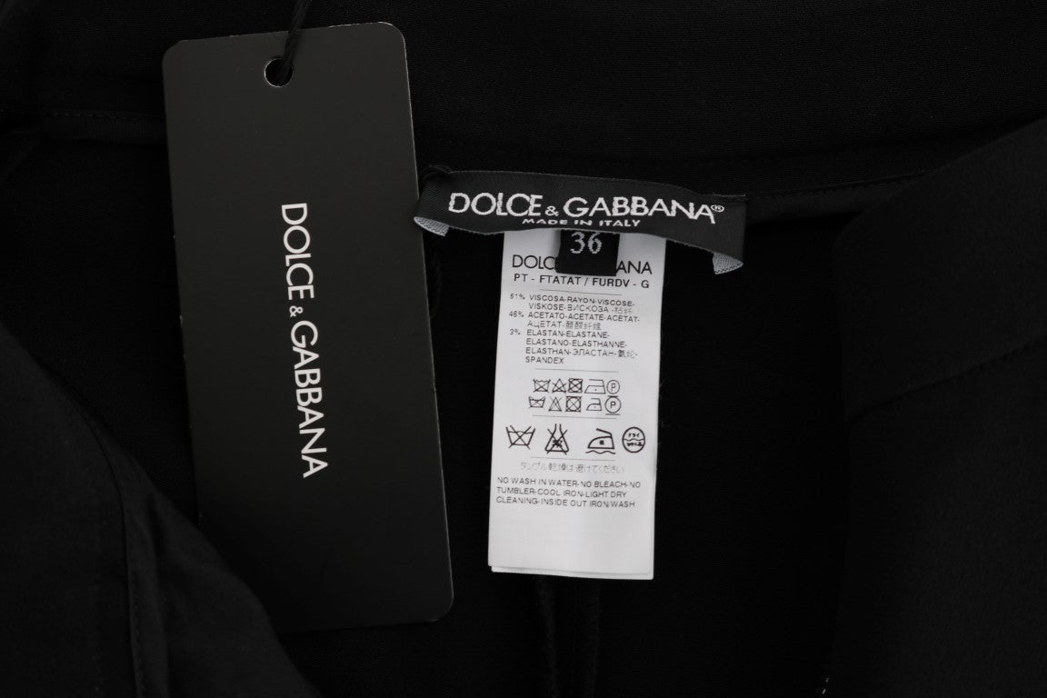 Pantalones capri negros elásticos con rayas rosas