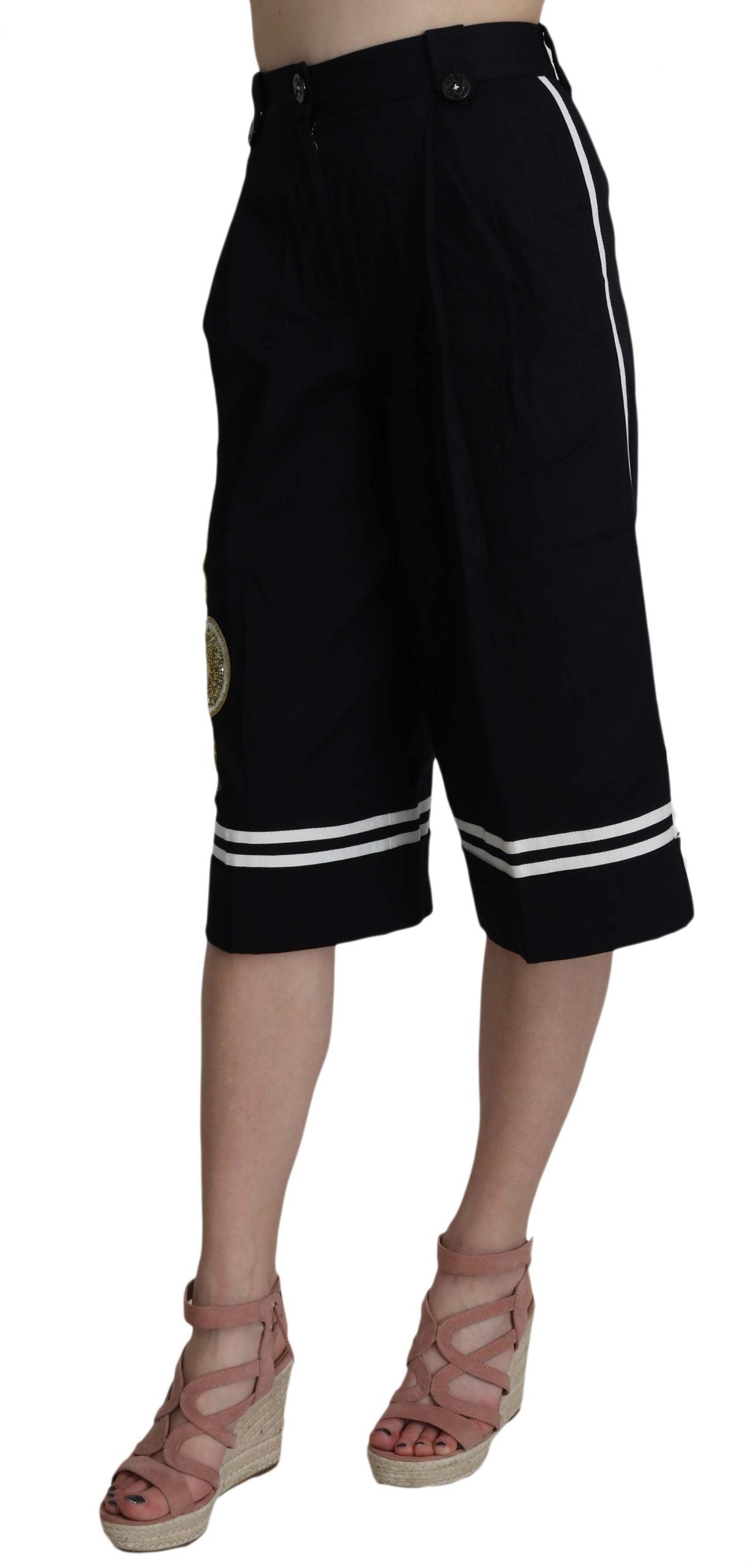 Pantalones negros de algodón con adornos y corte cropped