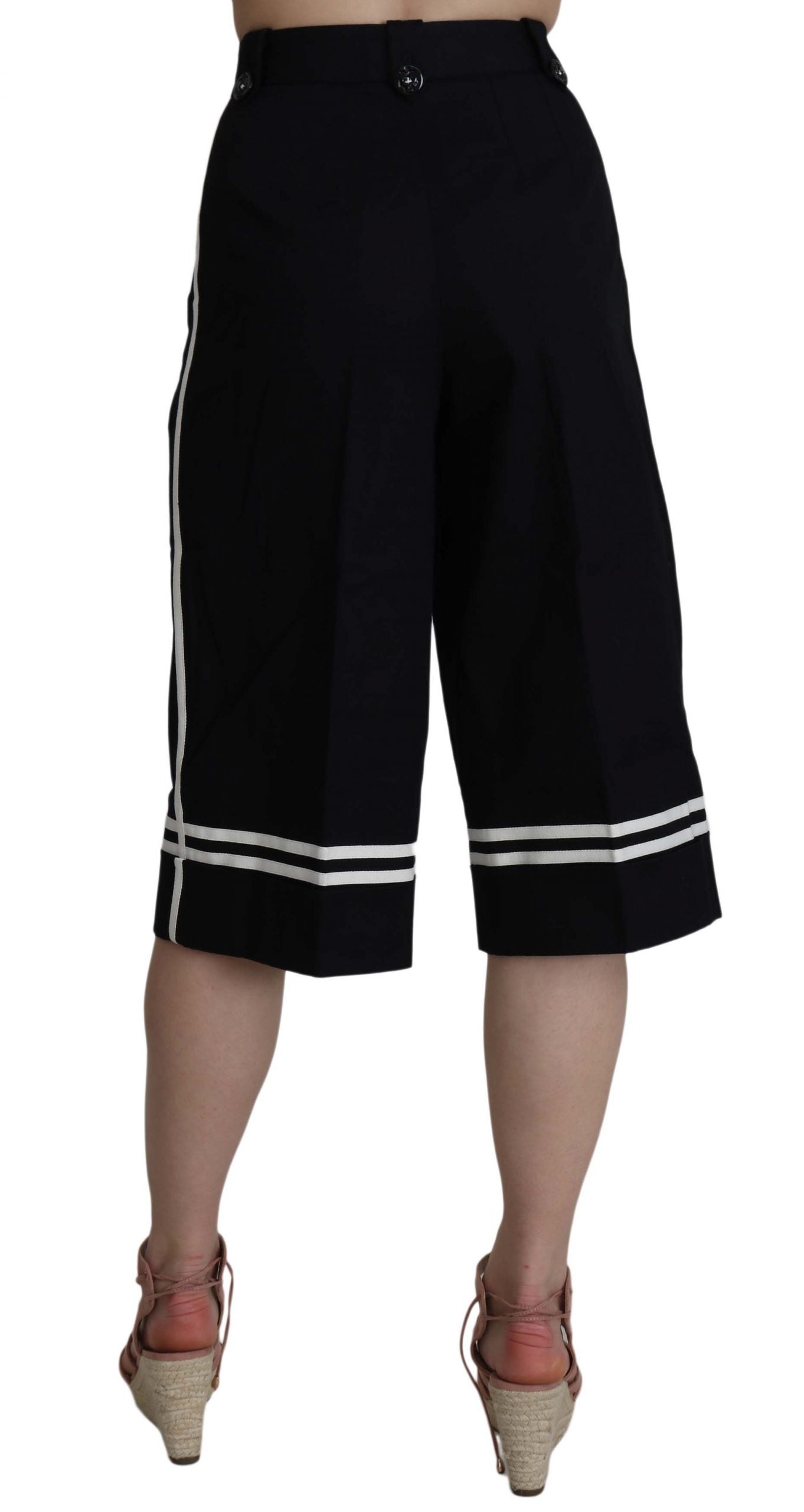 Pantalones negros de algodón con adornos y corte cropped