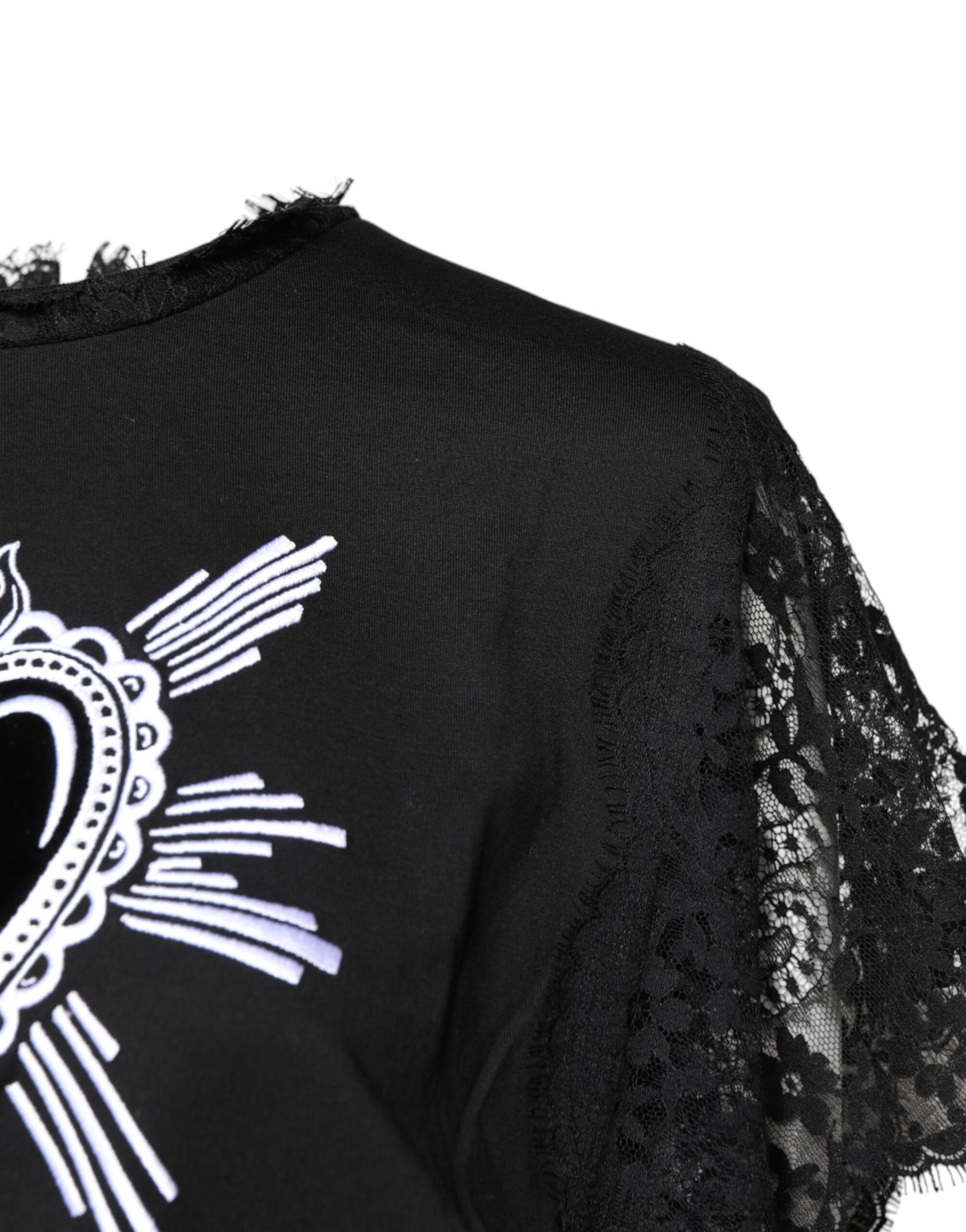Top de cuello redondo con encaje negro transparente y diseño de corazón sagrado