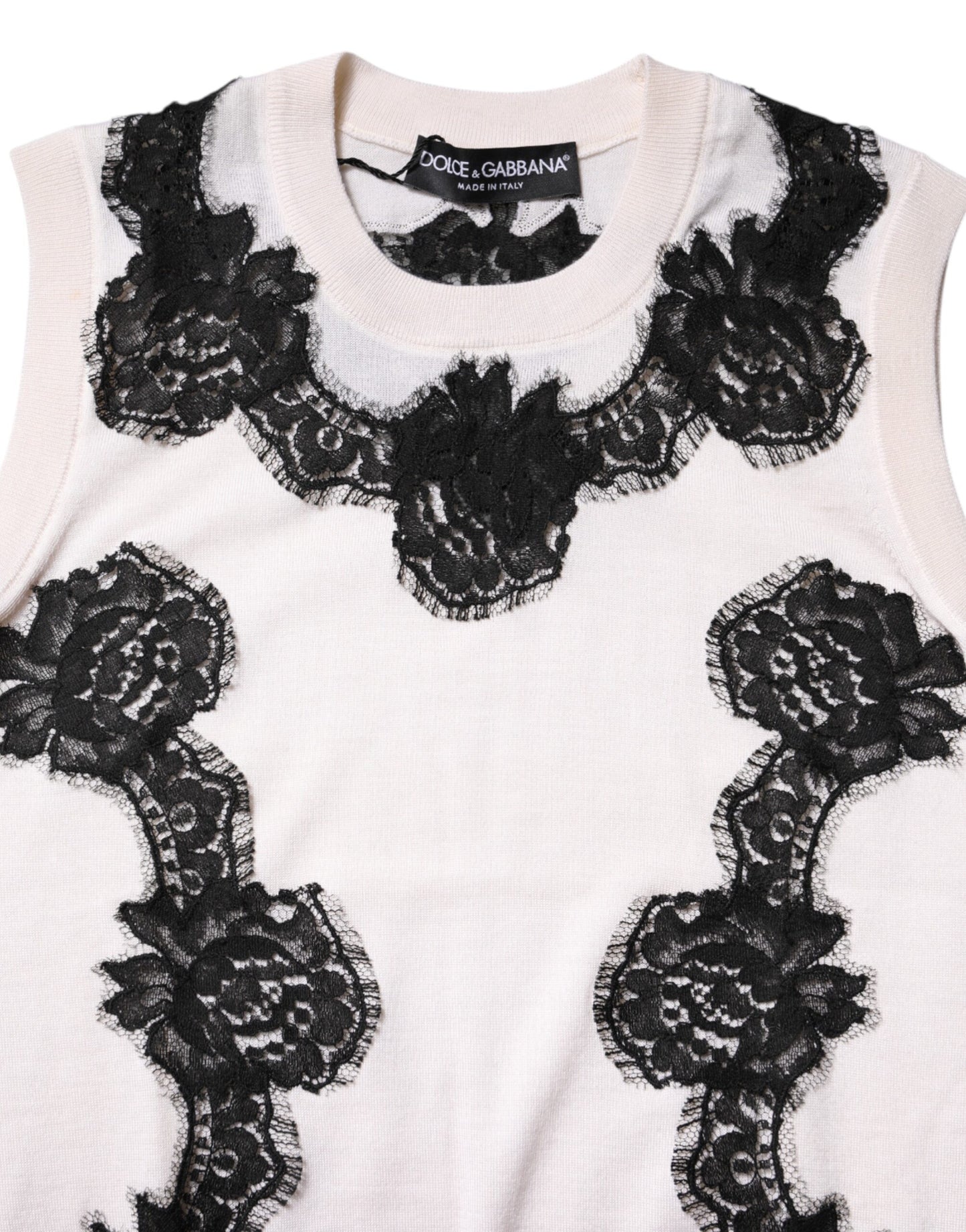 Camiseta sin mangas de cachemira blanca con detalles de encaje floral