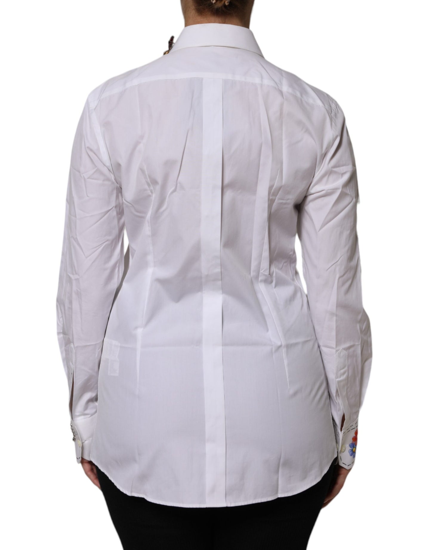 Camisa blanca de algodón con adornos florales