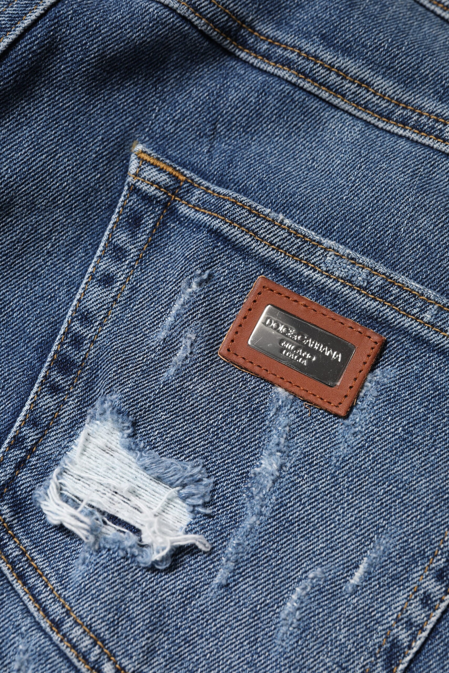 Vaqueros de cintura baja de algodón azul desgastado