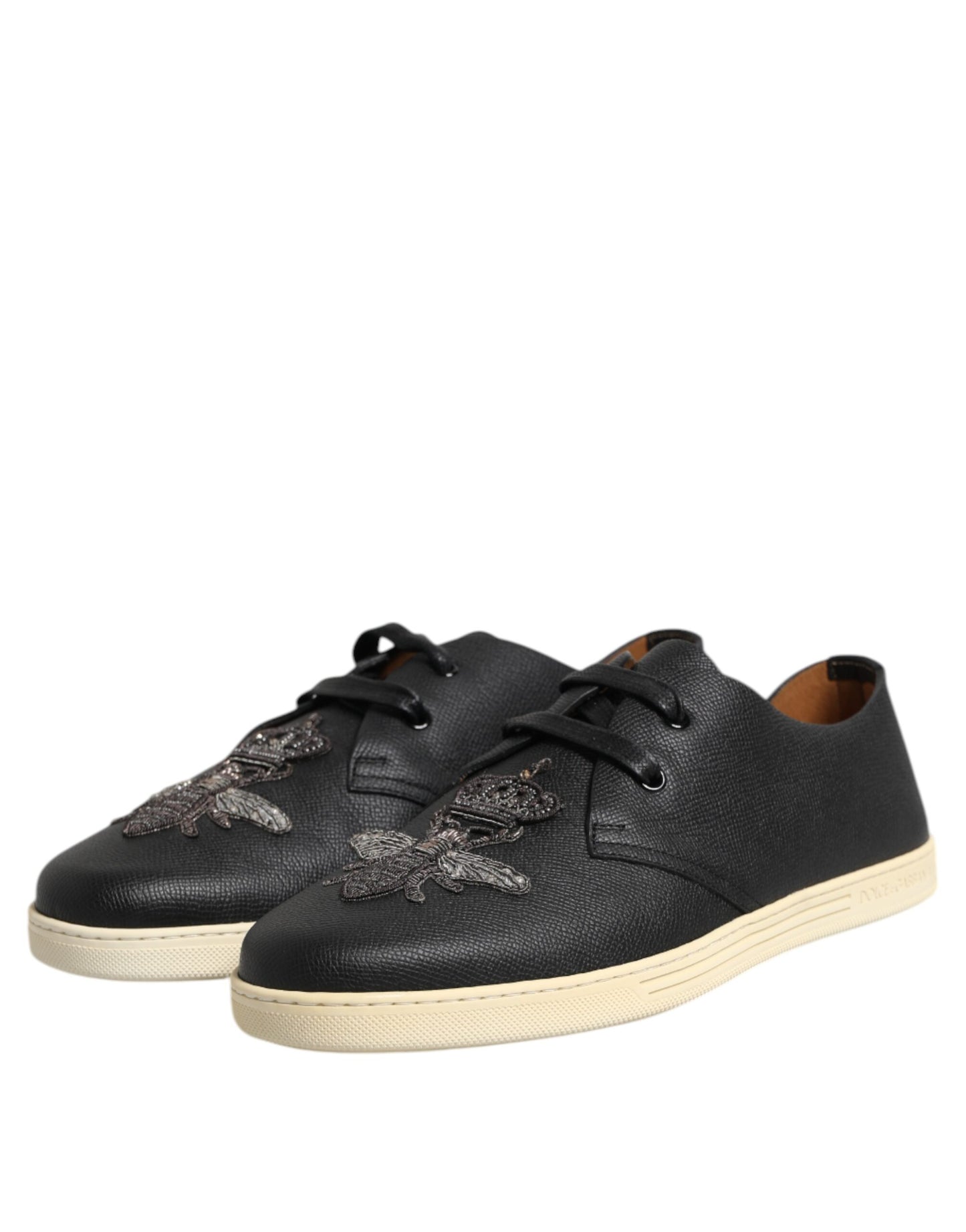 Zapatillas bajas de cuero negro con diseño de abeja y corona