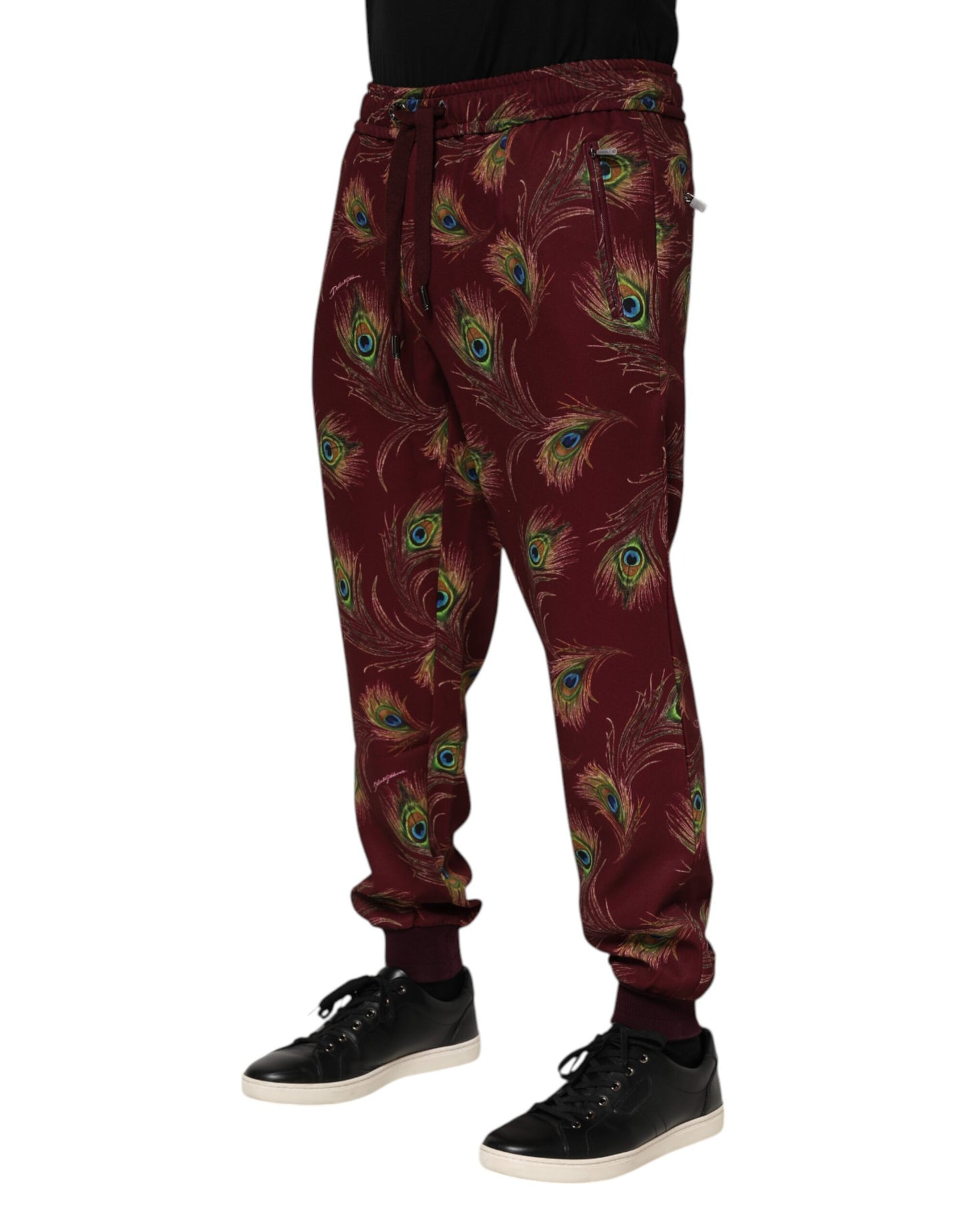 Pantalones deportivos con estampado de plumas de pavo real color burdeos