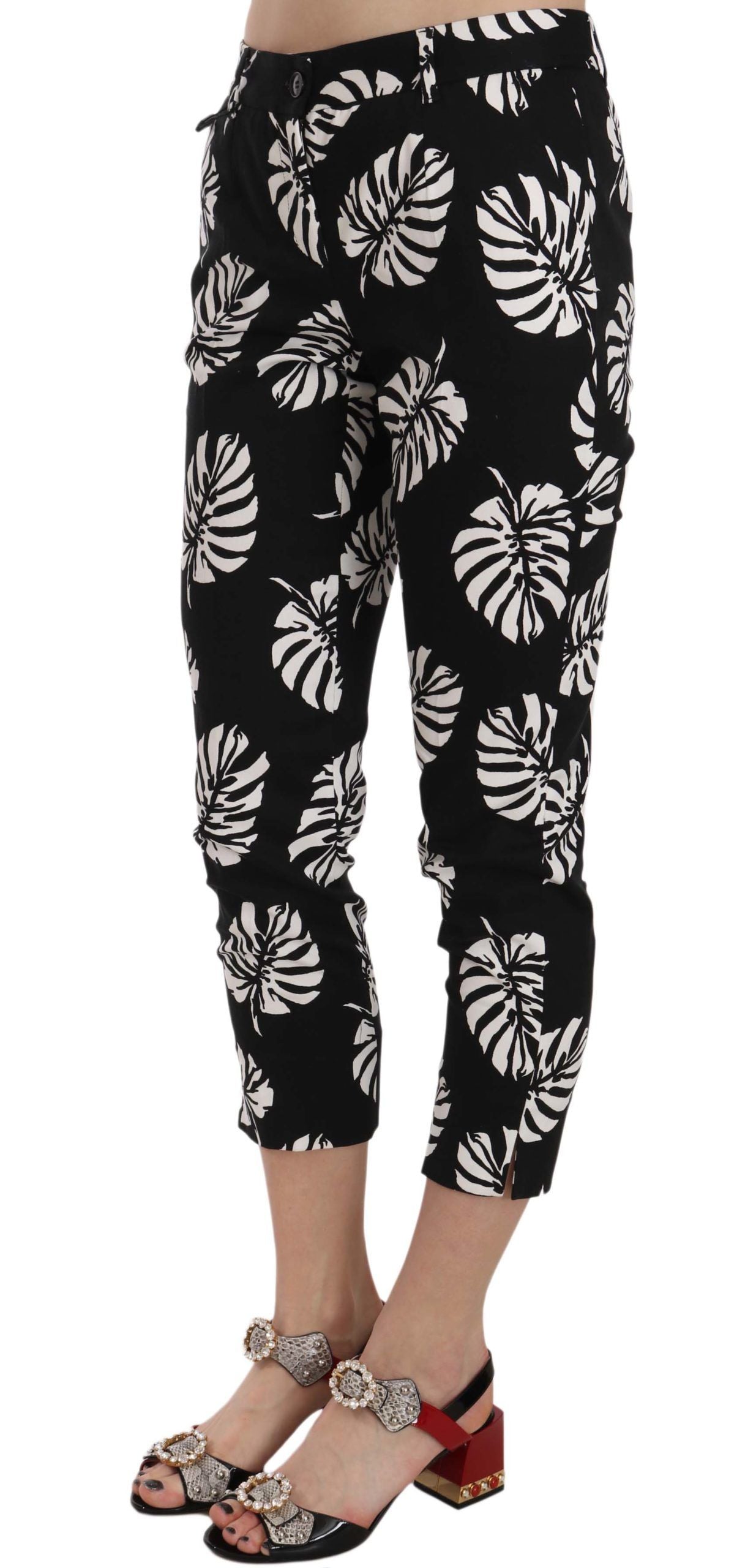 Pantalones ajustados con estampado de hojas de palma negras