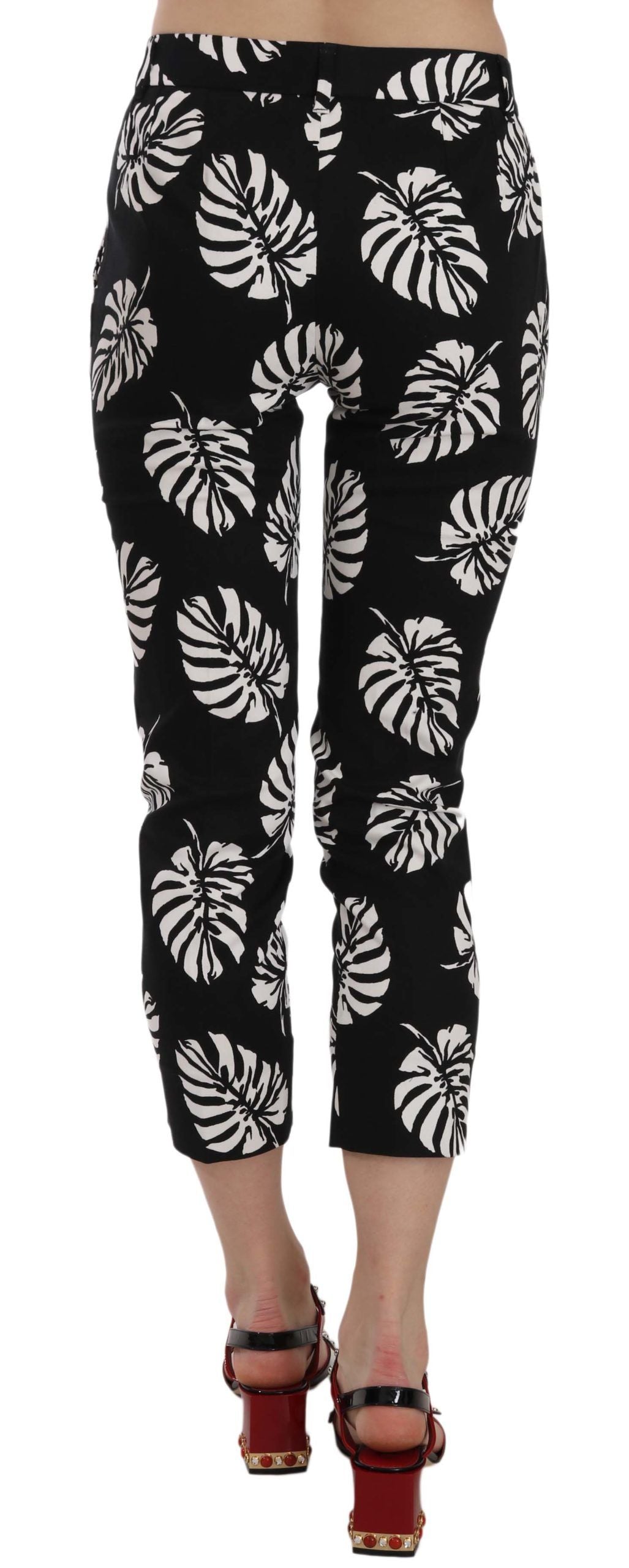 Pantalones ajustados con estampado de hojas de palma negras
