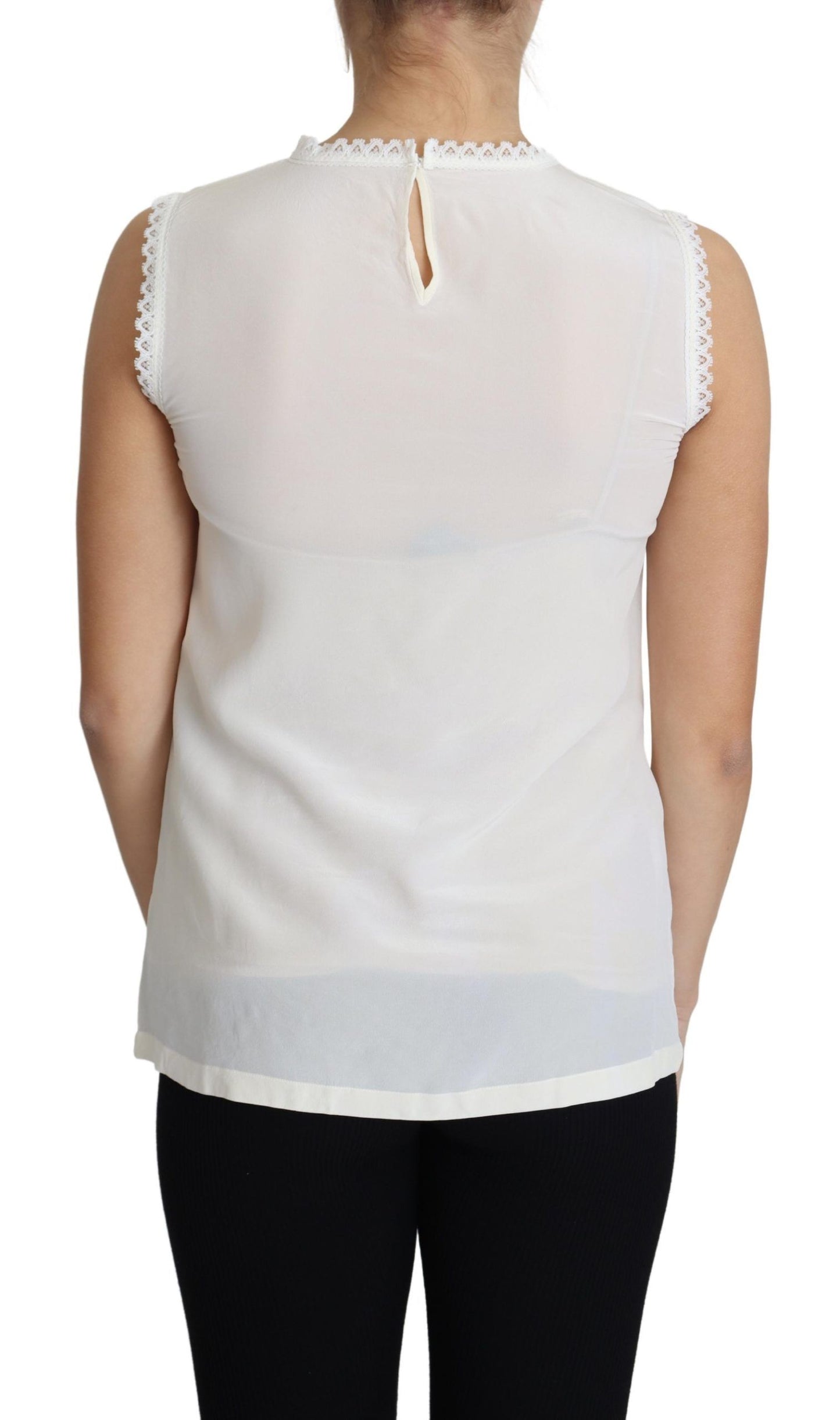 Blusa blanca sin mangas con ribete de encaje de seda