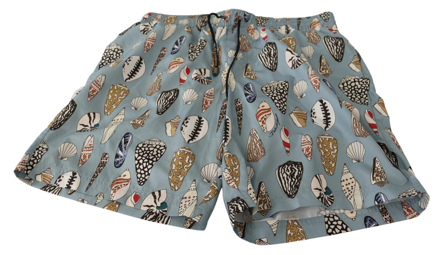Pantalones cortos de baño de playa con conchas azules