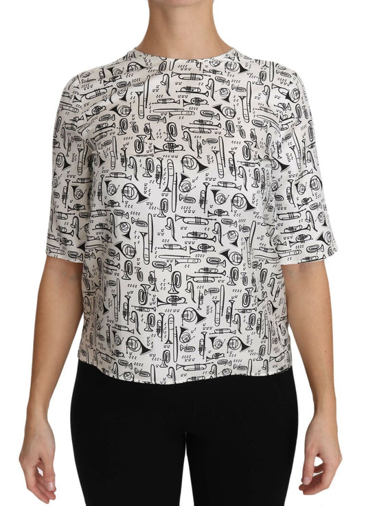 Blusa blanca con estampado de instrumentos musicales