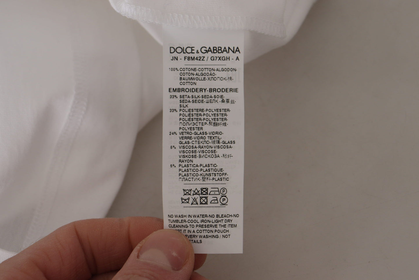 Camiseta blanca con lentejuelas y estampado floral de la corona DG
