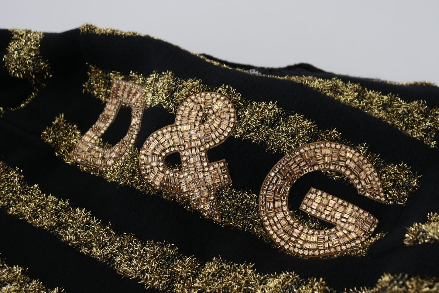 Suéter de cachemira con cristales D&amp;G en oro negro