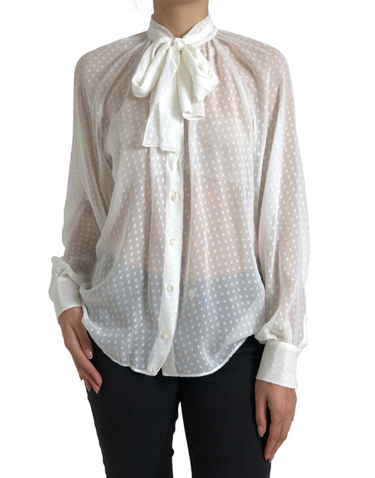 Blusa de lunares con cuello anudado de seda blanca transparente