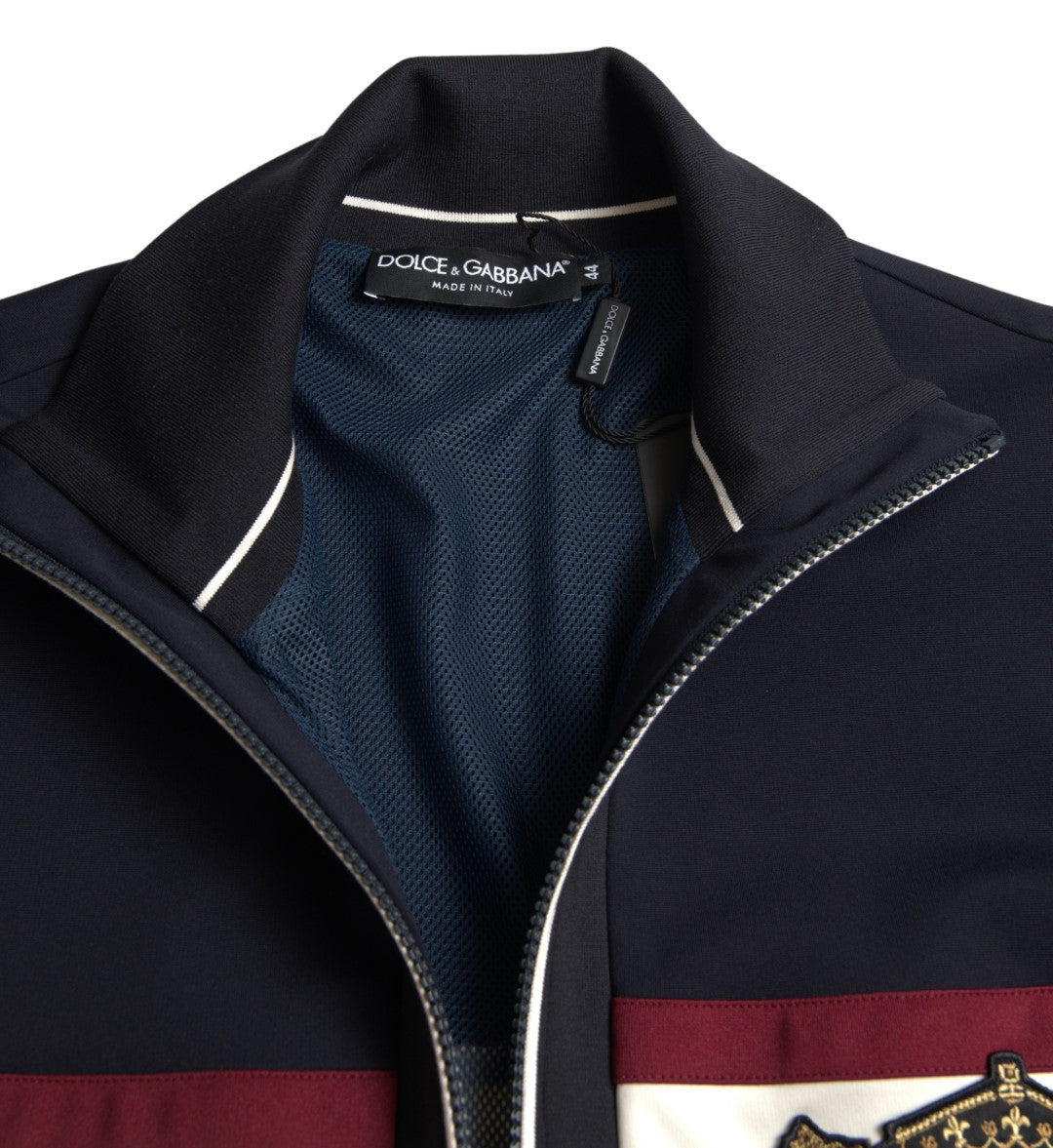 Pull zippé bleu à motif héraldique