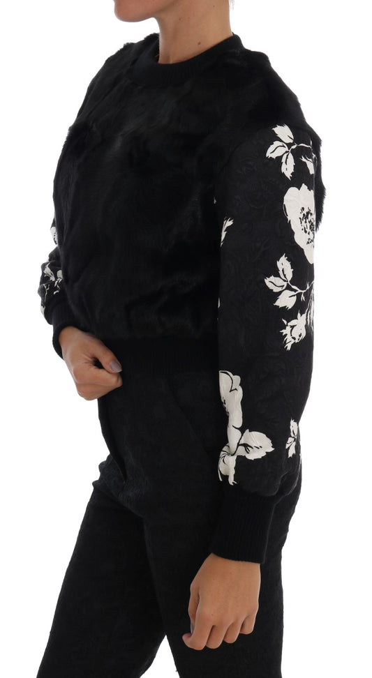 Suéter con cremallera y brocado floral de piel negra