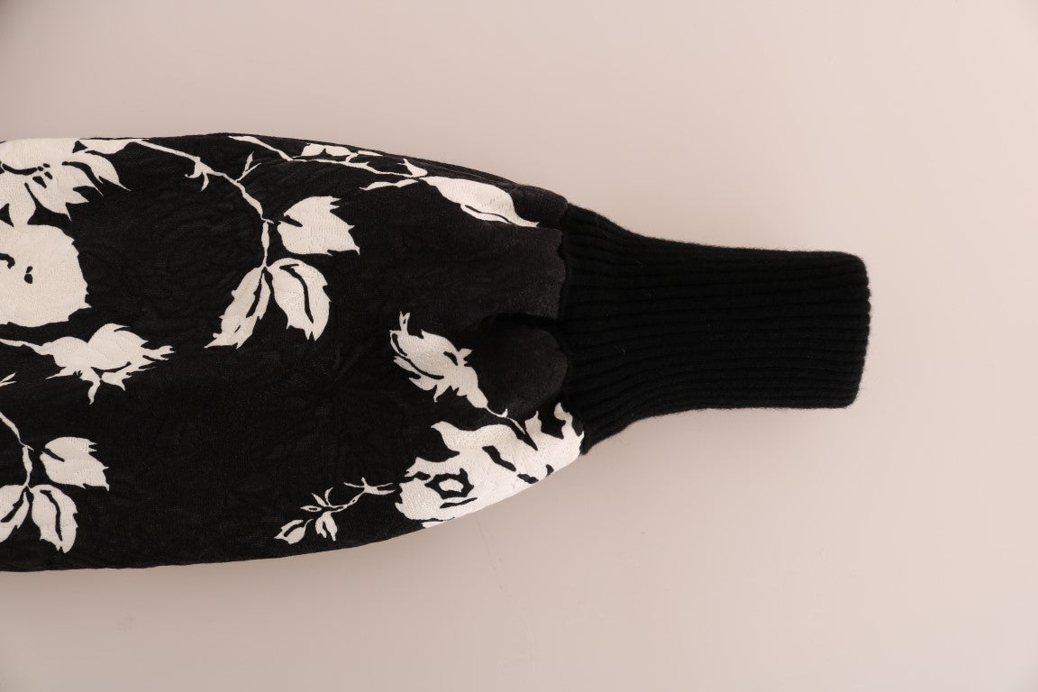 Suéter con cremallera y brocado floral de piel negra
