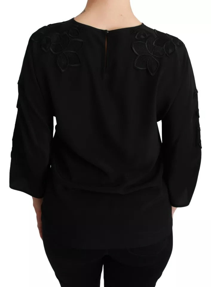 Blusa de seda negra con bordado floral
