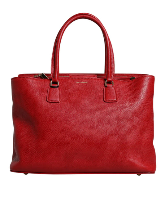 Bolso de mano con asa superior y placa con el logotipo en piel de becerro roja