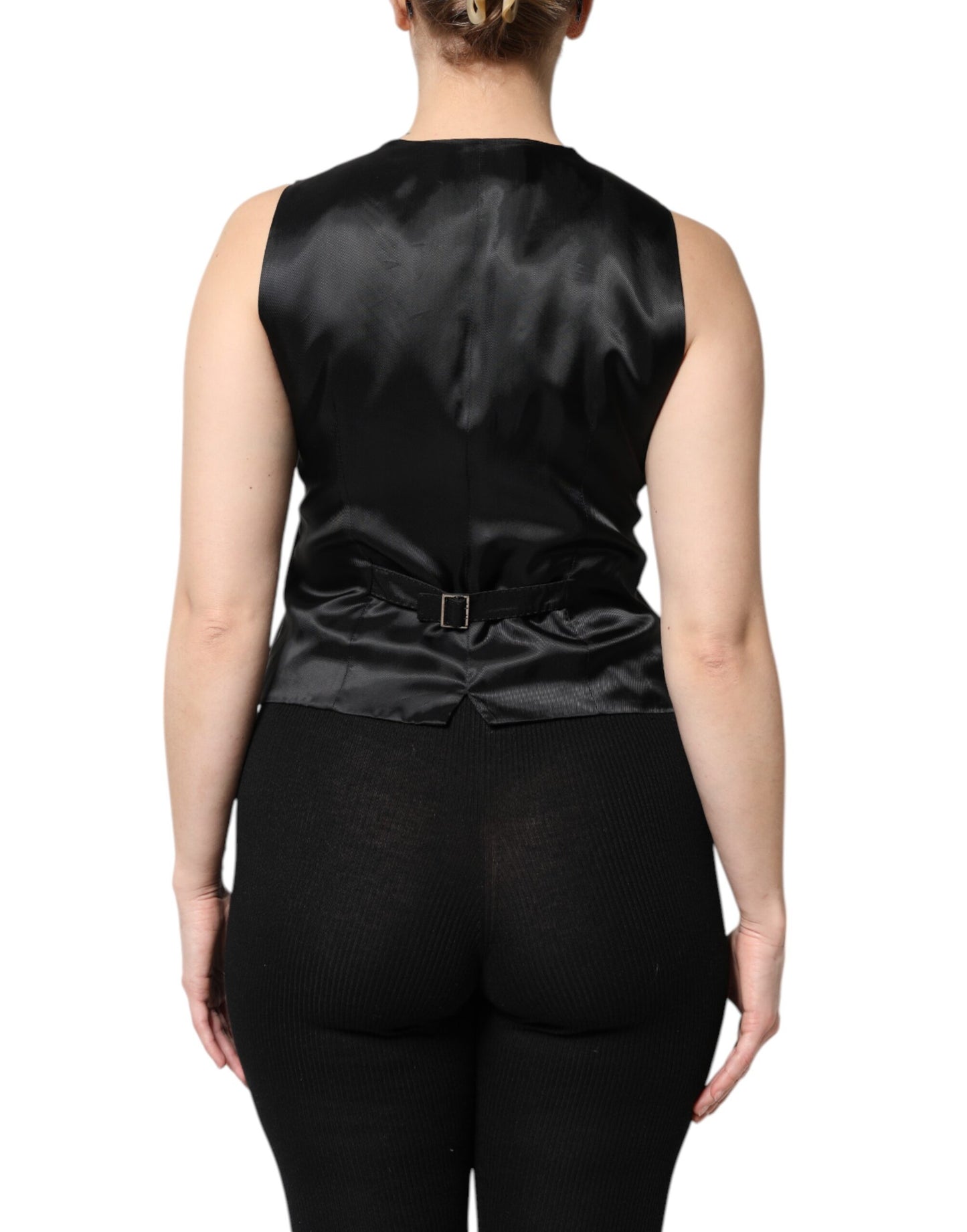 Top sin mangas con botones y rayas negras
