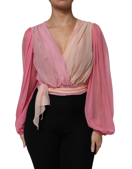 Blusa rosa de manga larga con escote en V pronunciado