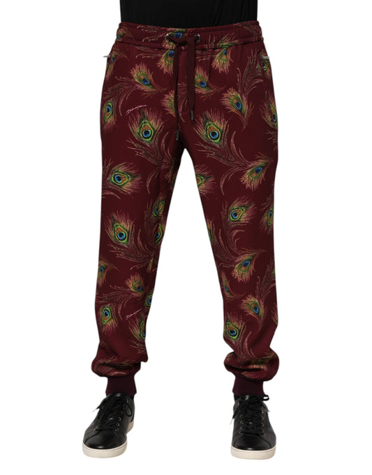 Pantalones deportivos con estampado de plumas de pavo real color burdeos