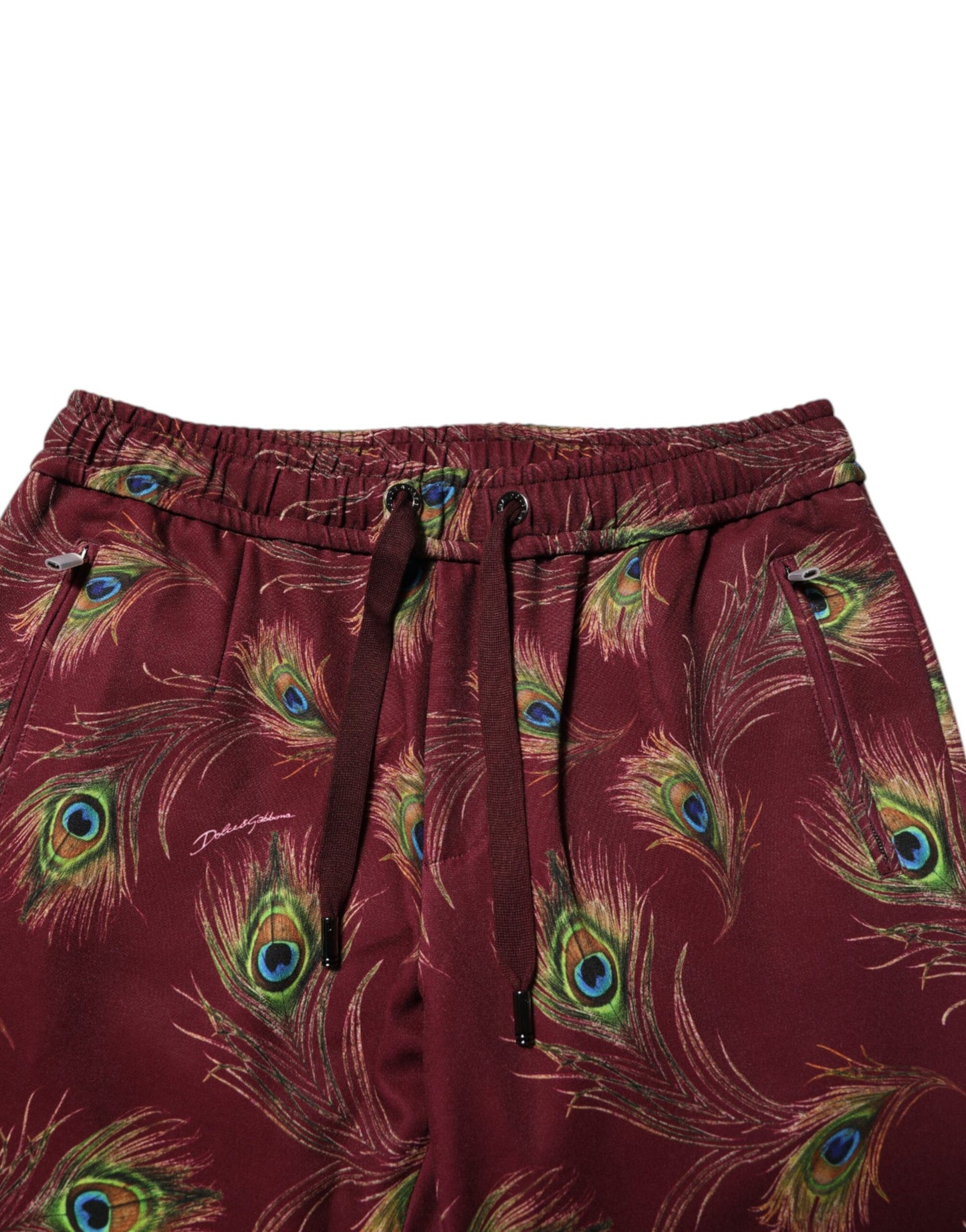 Pantalones deportivos con estampado de plumas de pavo real color burdeos
