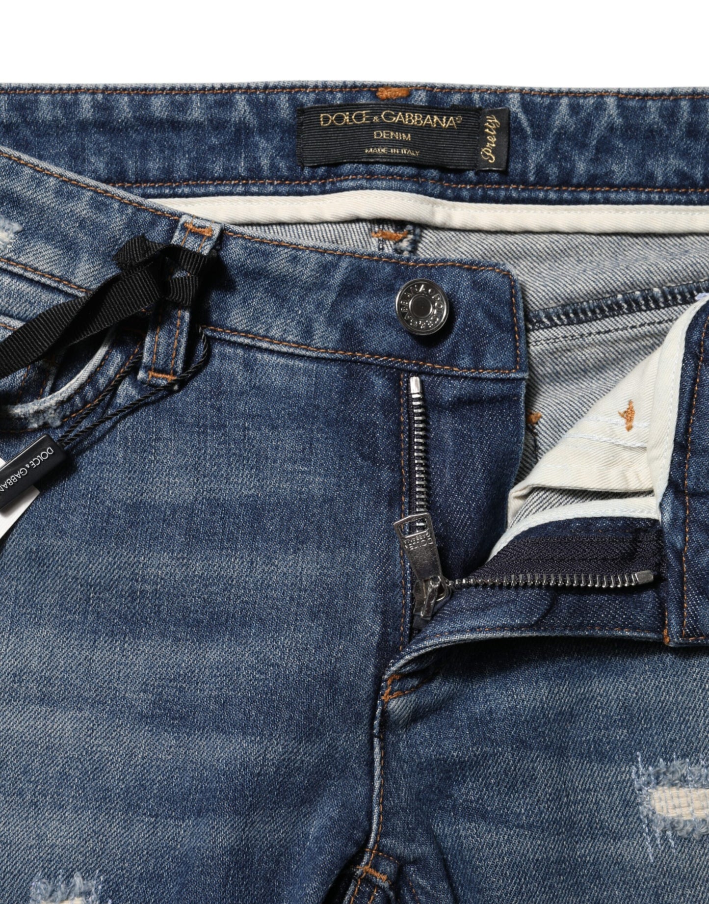 Vaqueros ajustados con bordado de cartas de juego azules 